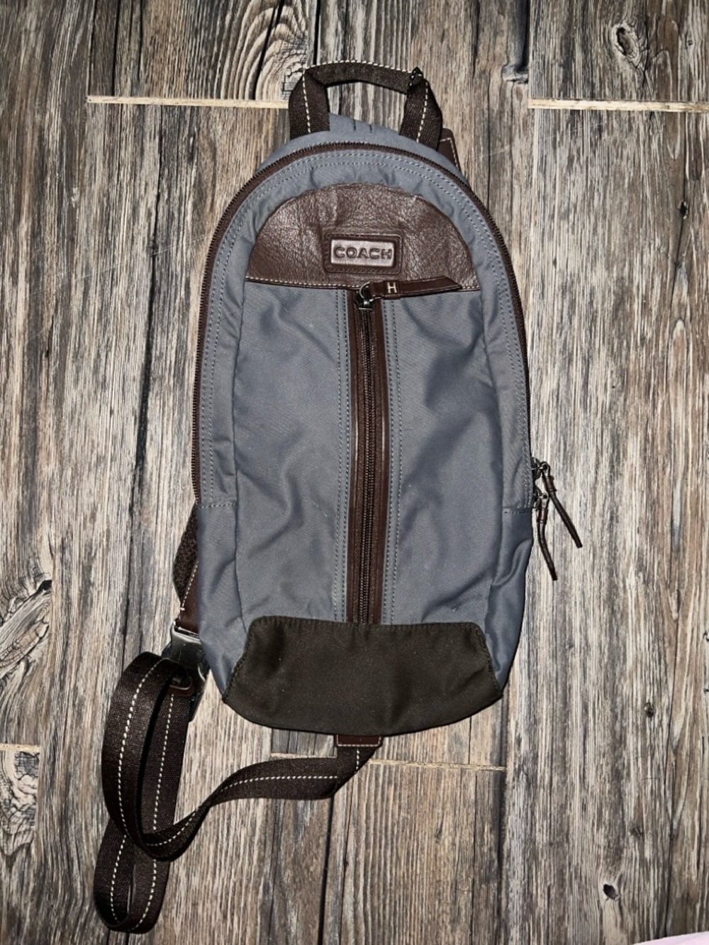 Coach sling backpack